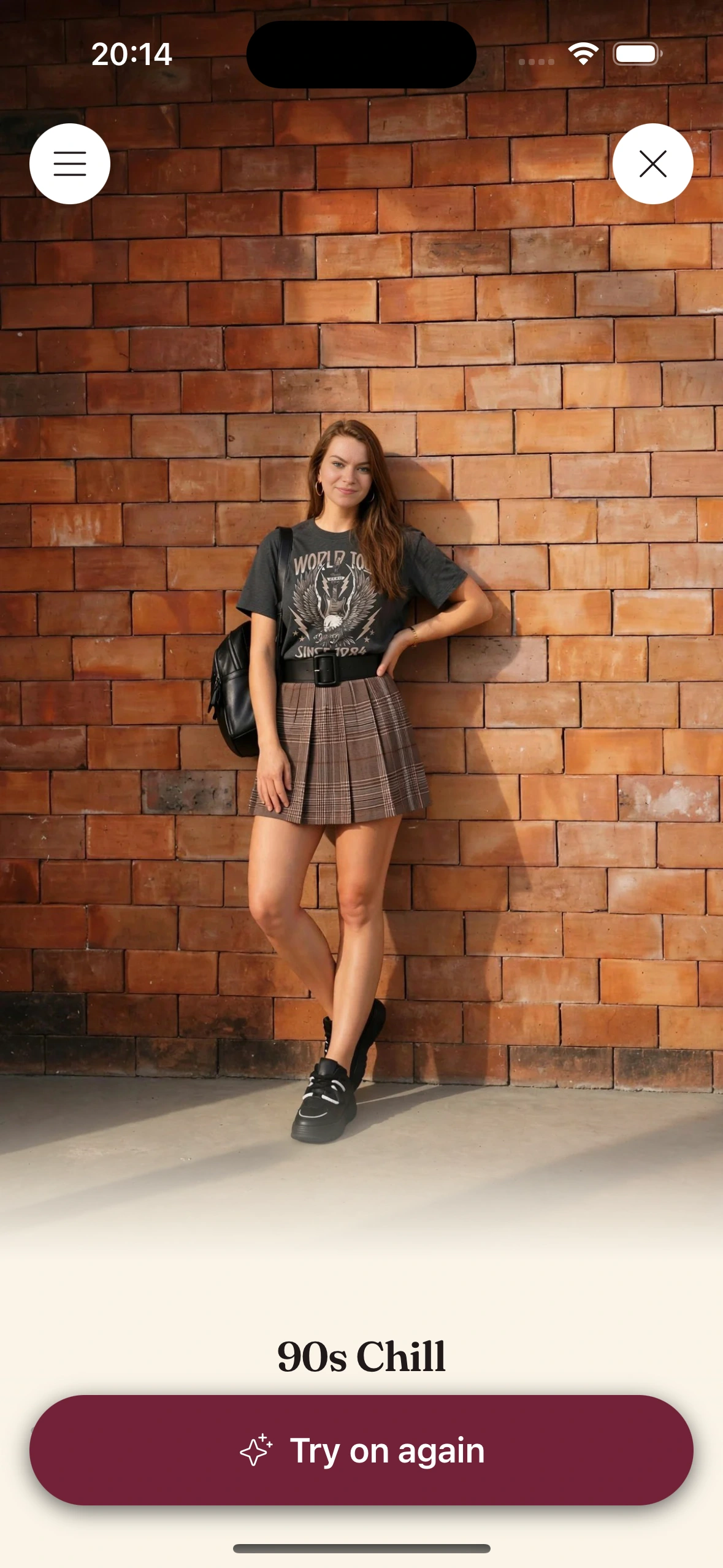 A virtual try-on render of a woman in a faded band tee, a wide black belt, a brown plaid pleated mini skirt and chunky black sneakers, with a black backpack, against a brick wall