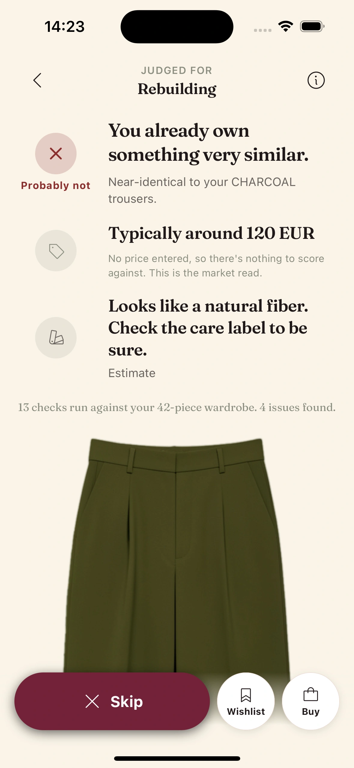 Clottr flags olive trousers as near-identical to charcoal trousers the user already owns, with a Probably not verdict